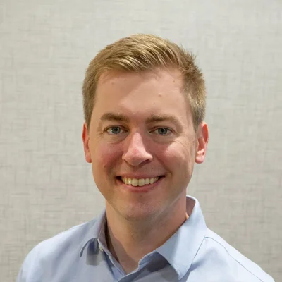 A headshot photo of Dr. Adam Clarke