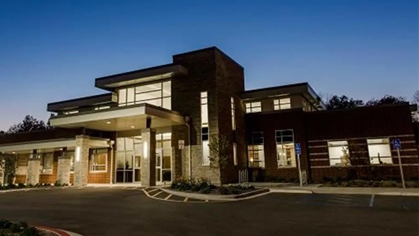 The exterior of the Restoration Eye Care building in evening light